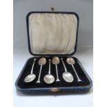 A cased set of hallmarked silver coffee spoons