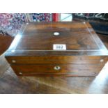 A rosewood jewellery box with mother of pearl inlay