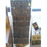 Eight American License plates - seven from 1920's and one 1944