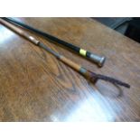 An antique bamboo sword stick and a silver topped walking cane