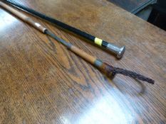 An antique bamboo sword stick and a silver topped walking cane