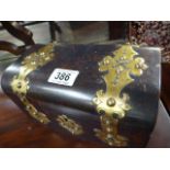 A Victorian faux tortoiseshell tea caddy with brass Gothic bindings