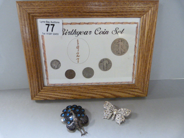 A Birthyear coin set - possibly silver, enamelled silver peacock brooch and one other