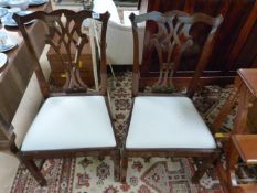 A Pair of ornate dining room chairs