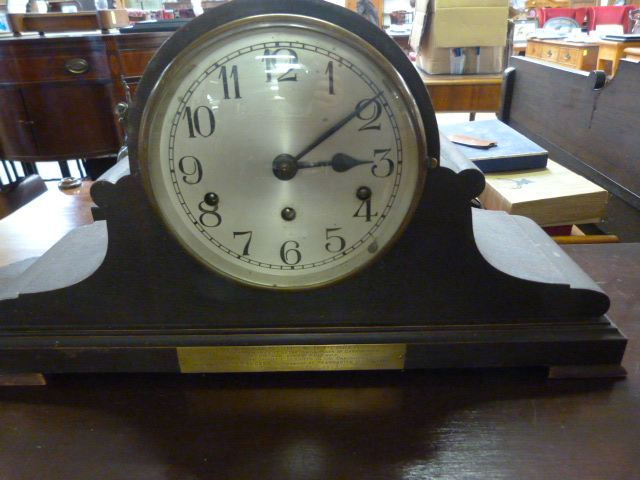 A laquered oak mantle clock (key in office)