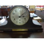 A laquered oak mantle clock (key in office)