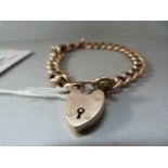 A 9ct rose gold bracelet with padlock- weight 13.1g