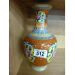 A Chinese vase with orange glaze, decorated with famille rose panels- seal mark to base