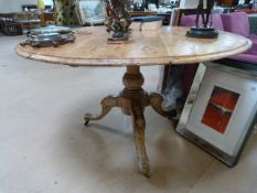 A round pine pedestal table