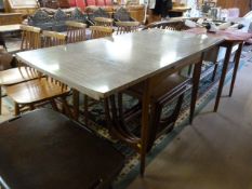 A Retro veneered kitchen table and two extra leaves