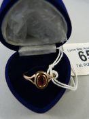 A 9ct gold and garnet ring