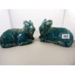 A pair of 19th century Chinese turquoise glazed recumbent rams- slight damage to one ear