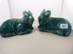 A pair of 19th century Chinese turquoise glazed recumbent rams- slight damage to one ear