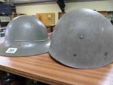 A WWII helmet issued to Western National Omnibus and one other
