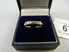 A diamond 7 stone ring set in 9ct gold
