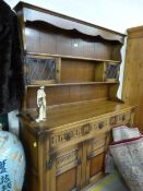 An oak dresser with glazed cabinets