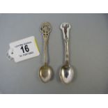 A continental hallmarked silver teaspoon and an enamelled topped silver teaspoon - depicting a