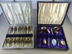 A set of cased hallmarked silver coffee spoons, and a part set of enamelled spoons along with