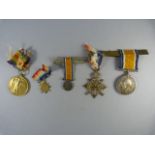 A set of three WWI medals, along with two miniatures presented to Captain T.W Reynolds (and later