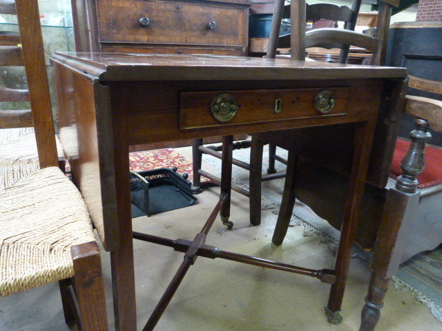 A Regency mahogany Pembroke table with cross stretchers