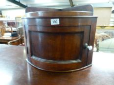 A small mahogany bow fronted corner cupboard
