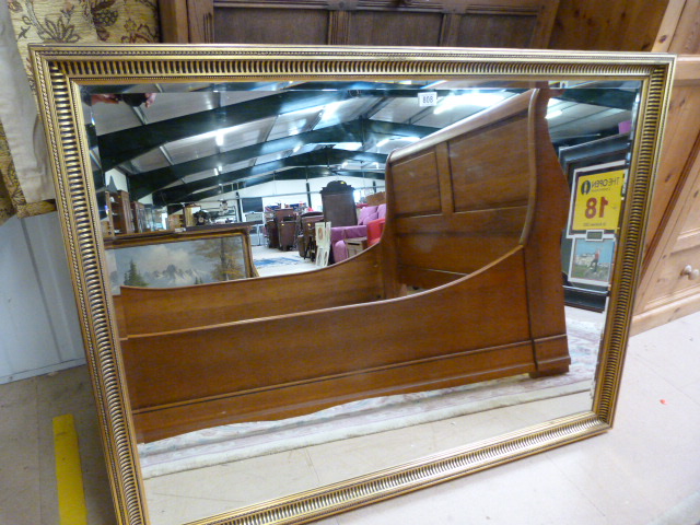 A large gilt framed mirror