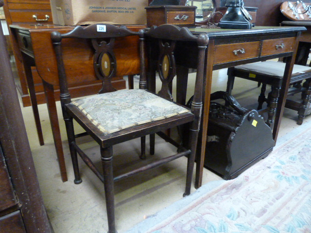 An edwardian corner chair inlaid with mother of pearl