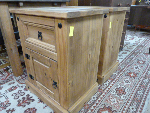 A pair of pine mexican bedside cabinets
