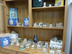 A quantity of Lilliput lane ornaments, and a quantity of cardboard boxes