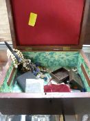 A small quantity of various costume jewellery in a rosewood jewellery box