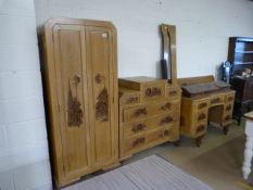 An oriental bedroom suite - with carved scenes inset. Consisting of Wardobe, chest of drawers,