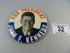 A large John F Kennedy Presidential campaign badge