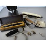 A collection of watches, cuff links and pens including Parker Slimfold pen with 14k nib.