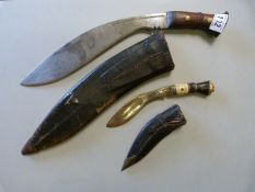 A 1929 war issue Kukri in leather scabbard and one other