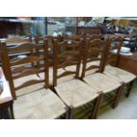 A set of eight oak ladder back chairs