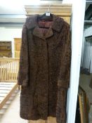 An Astrakhan full length ladies coat