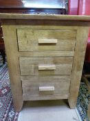 A three drawer bedside cabinet