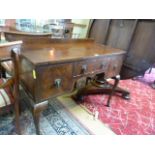 A small mahogany dressing table on cabriole legs