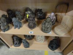 A large quantity of Resin figures on two shelves