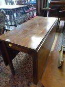 An elm drop leaf table