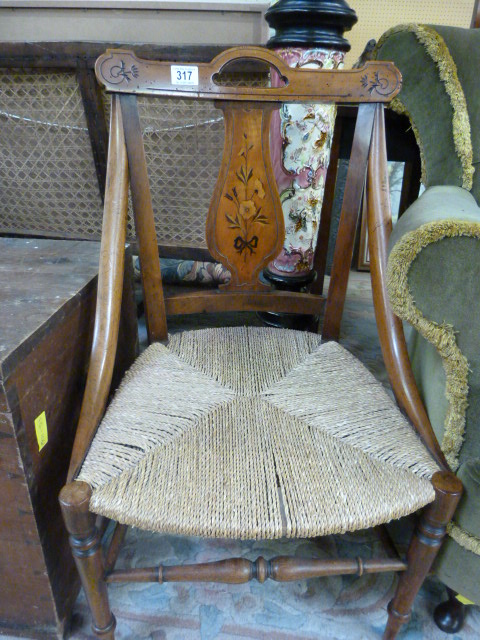 A rush seated chair with painted decoration