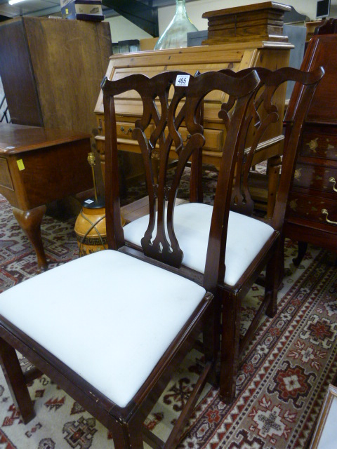 A Pair of ornate dining room chairs