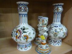 A pair of Delft onion vases and a pair of similar candlesticks