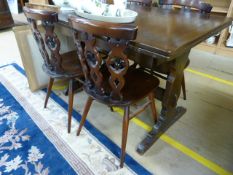 An Ercol table and four chairs