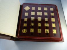 An incomplete set ( 52) gold on silver proofs of the world's first stamps- approx total weight 450-