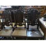 A harlequin set of carved chairs with rush seats and some wooden