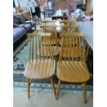 A set of six Ercol style blond dining chairs