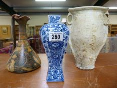 An oriental vase and two others