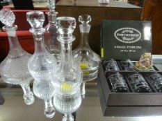 Five glass decanters, a set of six Portmeirion small tumblers and a Beswick Jeremy Fisher figure
