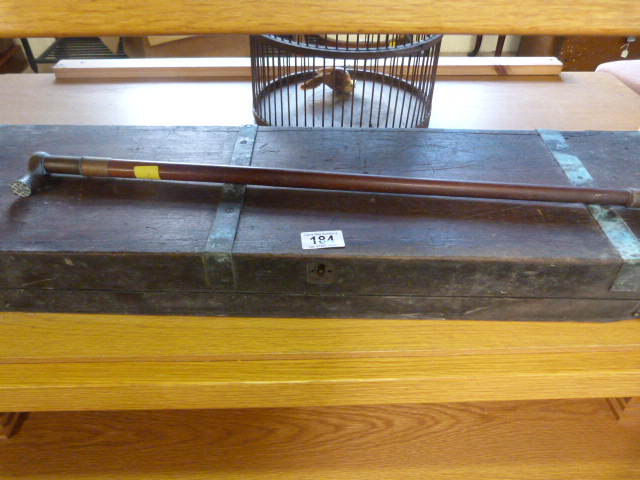 A brass bound gun case ( A/F) and a riding crop